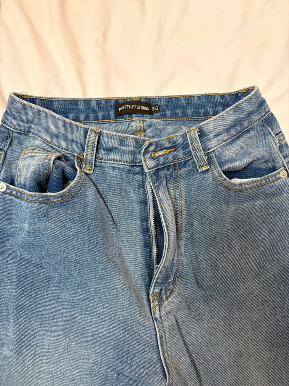 PrettyLittleThing medium blue denim jeans with slit